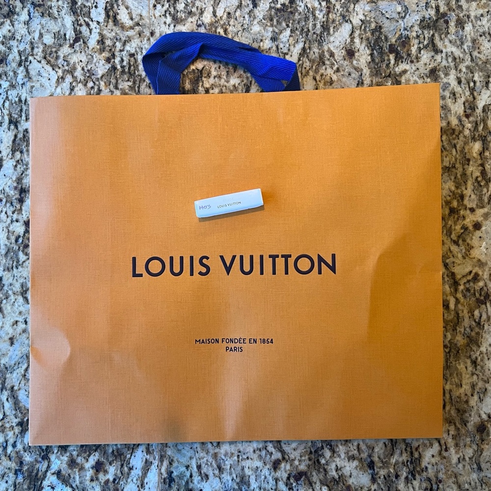 Medium Louis Vuitton Shopping Bag with Ribbon and Cologne.